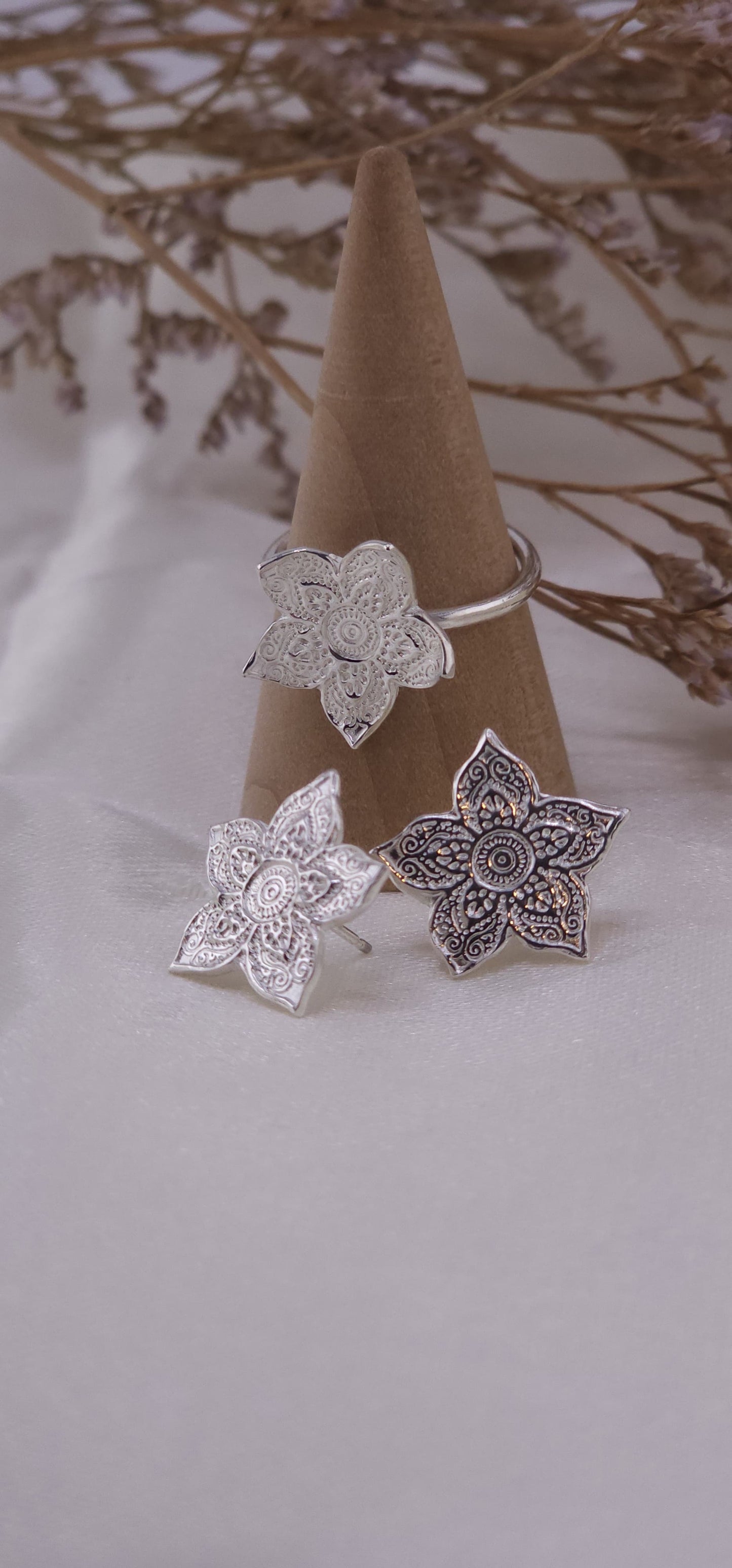 Sterling silver mandala stud earrings.