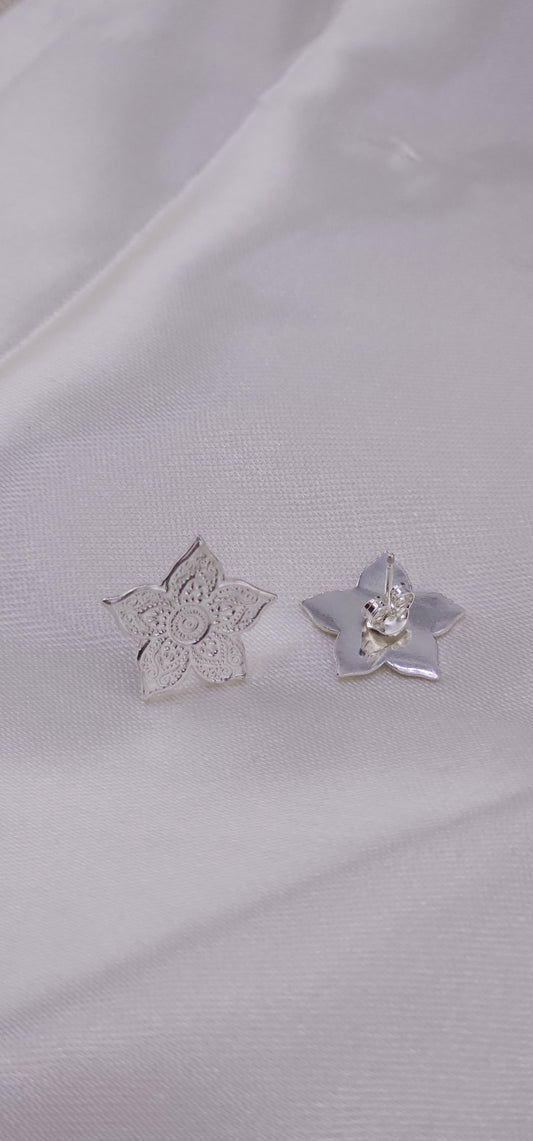 Sterling silver mandala stud earrings.