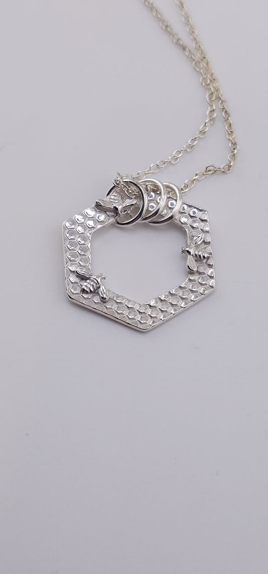 Unique textured honeycombe and bumble bee necklace, sterling silver and hallmarkable